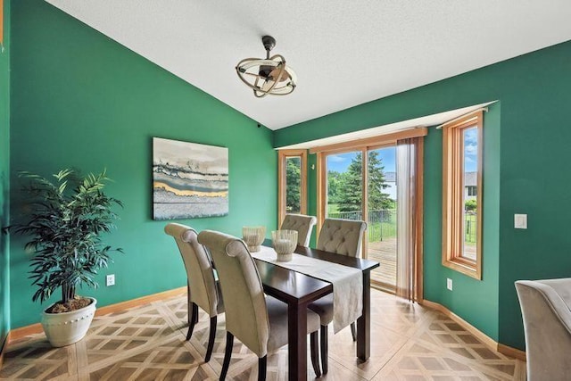 10374 61st St NE, Albertville, MN 55301 - dining area featuring vaulted ceiling and baseboards