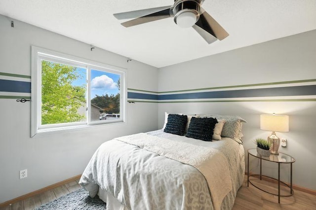 10374 61st St NE, Albertville, MN 55301 - bedroom with wood finished floors and ceiling fan
