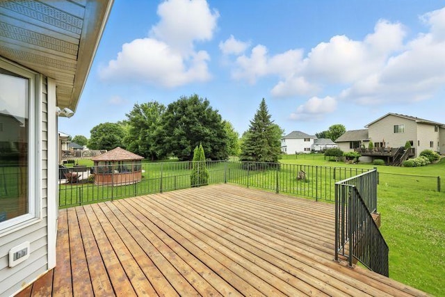 10374 61st St NE, Albertville, MN 55301 - wooden terrace featuring a gazebo, a yard, and a residential view
