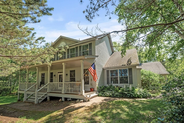 11691 115th St N, Grant, MN 55082 - view of front facade with a porch, a front lawn, and roof with shingles