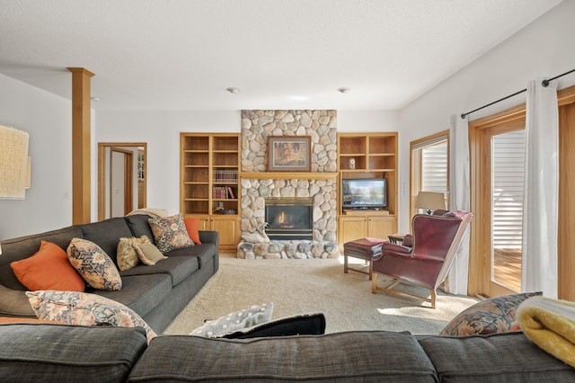 11691 115th St N, Grant, MN 55082 - living area with carpet flooring, a stone fireplace, and built in shelves