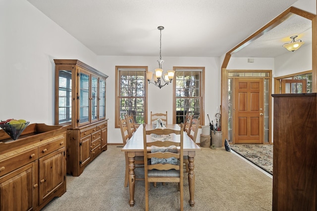 11691 115th St N, Grant, MN 55082 - dining space featuring a chandelier and light colored carpet