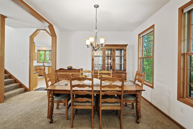 11691 115th St N, Grant, MN 55082 - carpeted dining room with a chandelier and stairway
