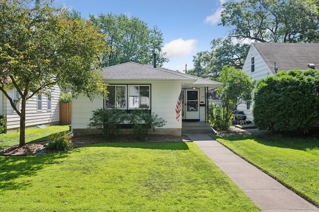 5737 20th Ave S, Minneapolis, MN 55417 - view of front of house featuring a front yard and roof with shingles