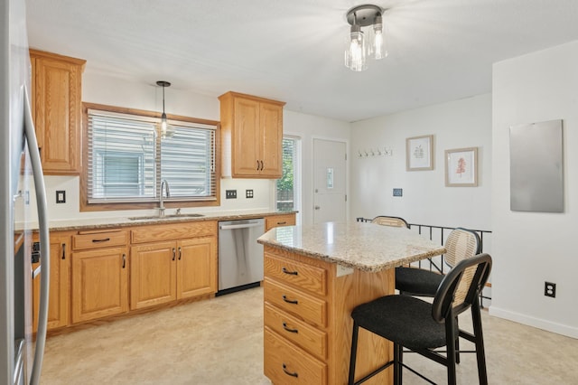 5737 20th Ave S, Minneapolis, MN 55417 - kitchen with appliances with stainless steel finishes, a kitchen bar, light stone countertops, a center island, and pendant lighting