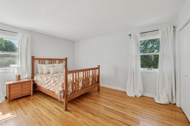 5737 20th Ave S, Minneapolis, MN 55417 - bedroom featuring multiple windows and light wood-style flooring