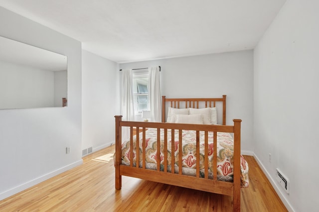 5737 20th Ave S, Minneapolis, MN 55417 - bedroom featuring wood finished floors and baseboard heating