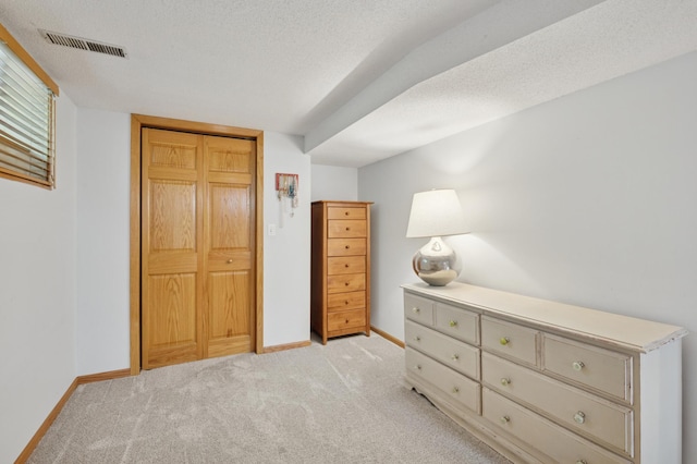 5737 20th Ave S, Minneapolis, MN 55417 - bedroom featuring light carpet, a closet, and a textured ceiling