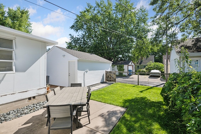 5737 20th Ave S, Minneapolis, MN 55417 - view of yard with outdoor dining area, a patio area, and an outbuilding