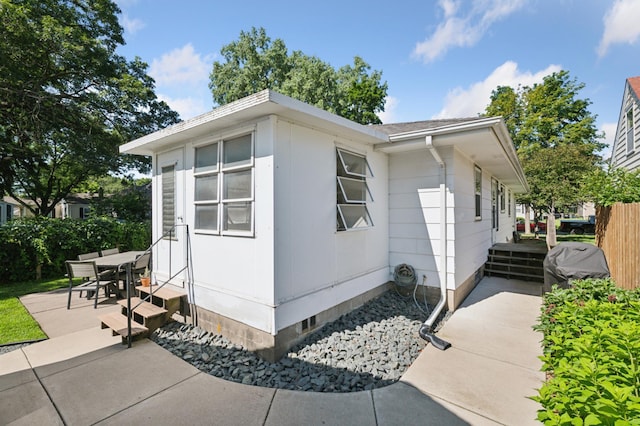 5737 20th Ave S, Minneapolis, MN 55417 - view of side of property featuring a patio area and entry steps