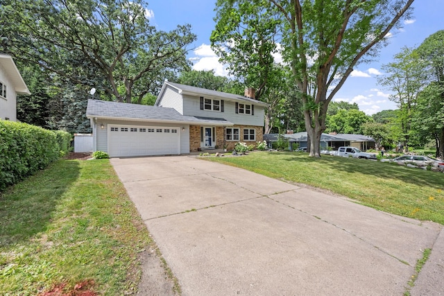 1762 Canyon Ln, New Brighton, MN 55112 - view of front of house featuring an attached garage, concrete driveway, a chimney, a front lawn, and brick siding