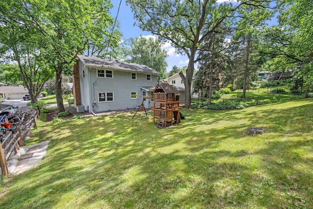1762 Canyon Ln, New Brighton, MN 55112 - view of green lawn featuring a playground