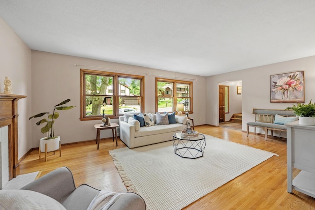 1762 Canyon Ln, New Brighton, MN 55112 - living room featuring light wood-style floors and arched walkways