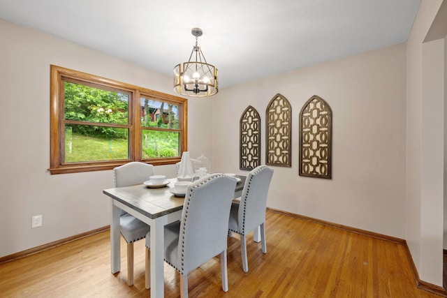 1762 Canyon Ln, New Brighton, MN 55112 - dining area with a chandelier and light wood-style flooring