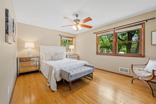1762 Canyon Ln, New Brighton, MN 55112 - bedroom with light wood-style flooring and ceiling fan