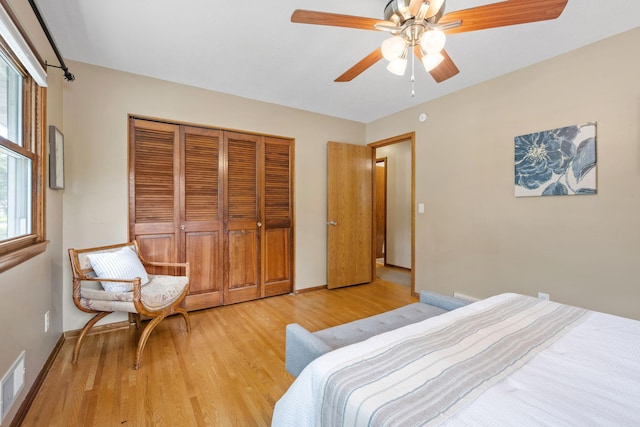 1762 Canyon Ln, New Brighton, MN 55112 - unfurnished bedroom with light wood finished floors, a closet, and a ceiling fan