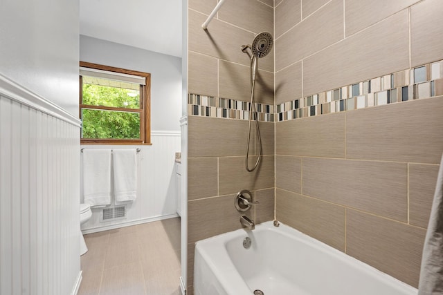 1762 Canyon Ln, New Brighton, MN 55112 - bathroom featuring shower / tub combination and a wainscoted wall
