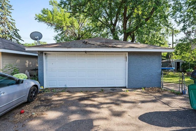 2813 Ohenry Rd, Brooklyn Center, MN 55430 - detached garage featuring a trampoline