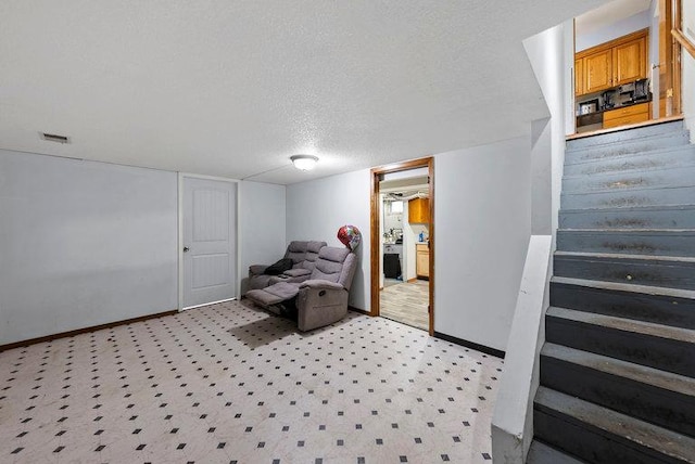2813 Ohenry Rd, Brooklyn Center, MN 55430 - living area with stairway and a textured ceiling