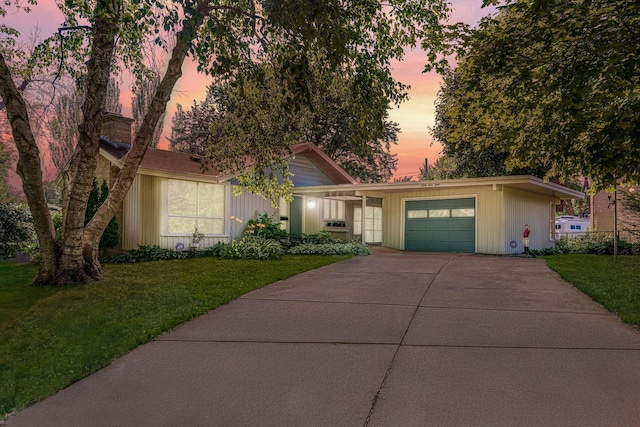 3330 Belden Dr NE, Saint Anthony, MN 55418 - mid-century home with concrete driveway, an attached garage, and a front lawn