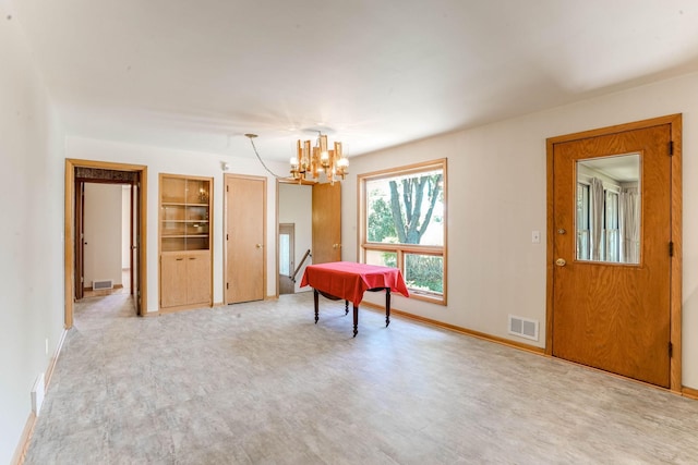 3330 Belden Dr NE, Saint Anthony, MN 55418 - sitting room featuring wood finished floors, a chandelier, and built in shelves