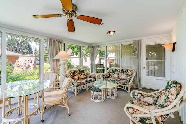 3330 Belden Dr NE, Saint Anthony, MN 55418 - sunroom featuring ceiling fan, outdoor lounge area, and carpet floors