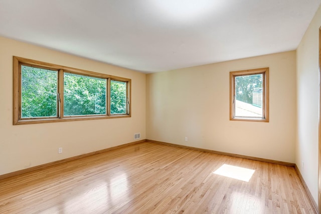 3330 Belden Dr NE, Saint Anthony, MN 55418 - unfurnished room featuring light wood-style floors and baseboards