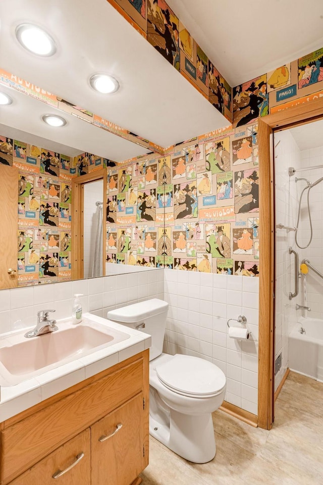 3330 Belden Dr NE, Saint Anthony, MN 55418 - bathroom with vanity, shower / tub combo, tile walls, and recessed lighting
