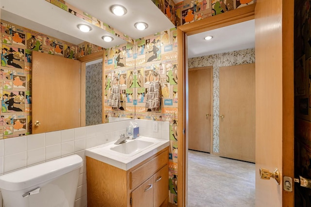 3330 Belden Dr NE, Saint Anthony, MN 55418 - bathroom featuring wallpapered walls and vanity