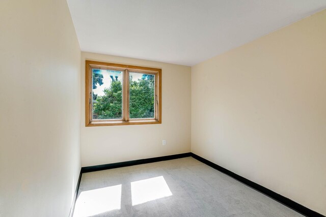 3330 Belden Dr NE, Saint Anthony, MN 55418 - empty room featuring light colored carpet and baseboards