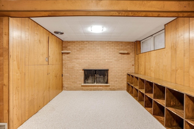 3330 Belden Dr NE, Saint Anthony, MN 55418 - unfurnished living room with wooden walls, carpet, and a fireplace