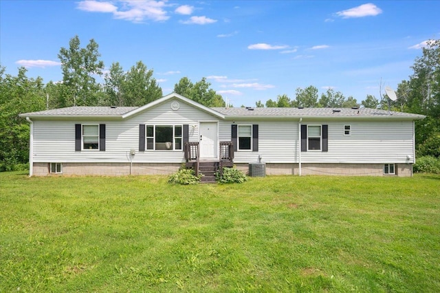 4179 W Tischer Rd, Rice Lake, MN 55803 - back of house with a lawn and roof with shingles