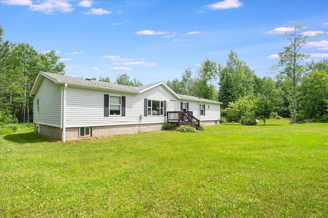 4179 W Tischer Rd, Rice Lake, MN 55803 - rear view of house featuring a lawn and a shingled roof