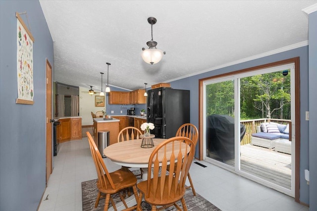 4179 W Tischer Rd, Rice Lake, MN 55803 - dining space featuring a textured ceiling and crown molding