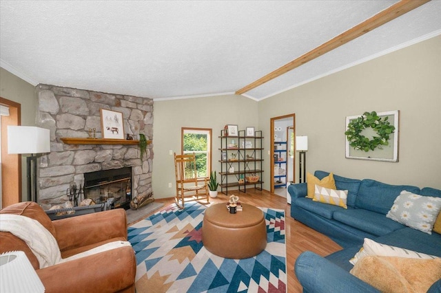 4179 W Tischer Rd, Rice Lake, MN 55803 - living area with ornamental molding, a fireplace, lofted ceiling, wood finished floors, and a textured ceiling