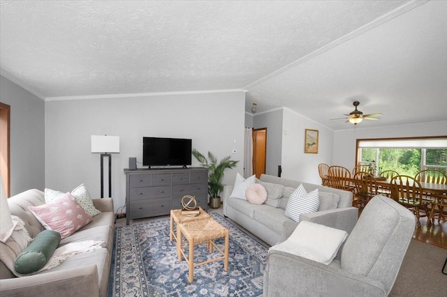 4179 W Tischer Rd, Rice Lake, MN 55803 - living area with vaulted ceiling, a ceiling fan, ornamental molding, and a textured ceiling