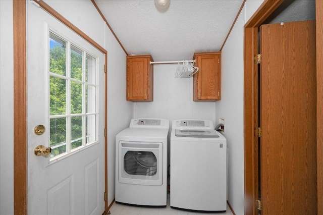 4179 W Tischer Rd, Rice Lake, MN 55803 - washroom with cabinet space, separate washer and dryer, and a textured ceiling