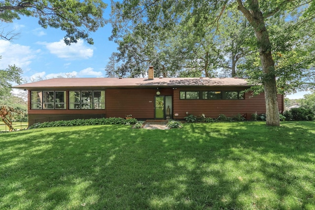 789 Viking Dr E, Little Canada, MN 55117 - view of front facade featuring a front lawn and a chimney