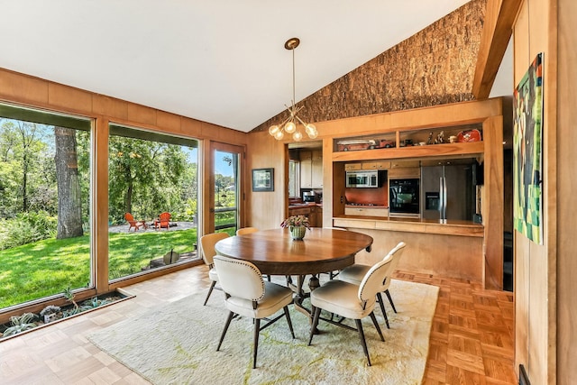 789 Viking Dr E, Little Canada, MN 55117 - dining space with plenty of natural light, wood walls, and high vaulted ceiling