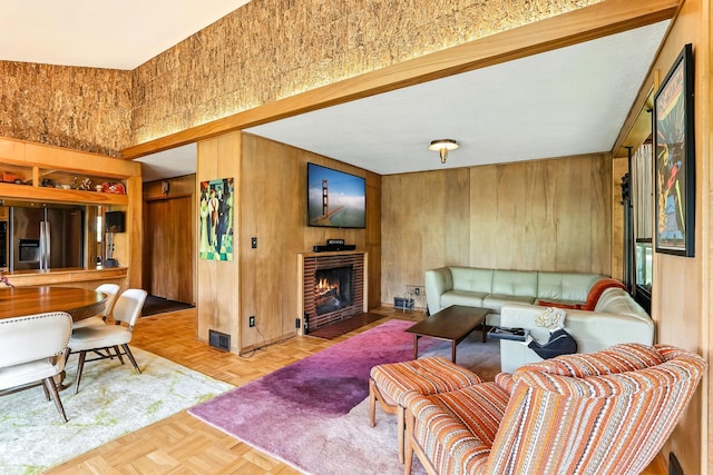 789 Viking Dr E, Little Canada, MN 55117 - living room featuring wooden walls and a fireplace