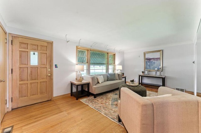 7501 Elliot Ave S, Richfield, MN 55423 - living area featuring light wood finished floors and crown molding