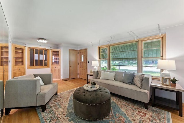 7501 Elliot Ave S, Richfield, MN 55423 - living area featuring wood finished floors and ornamental molding