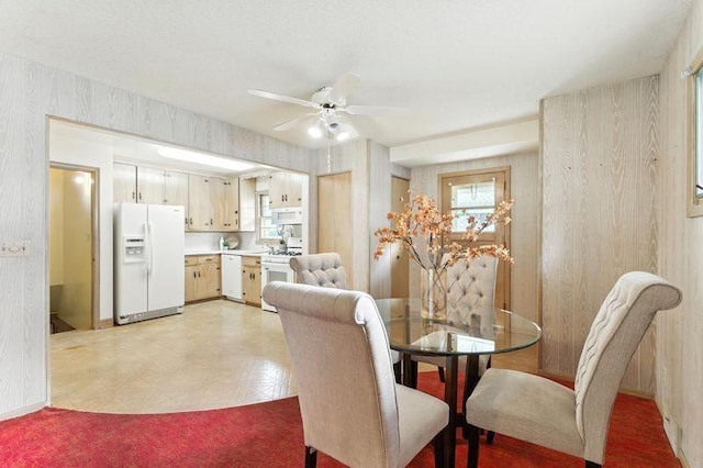 7501 Elliot Ave S, Richfield, MN 55423 - dining area with ceiling fan, wallpapered walls, and light flooring