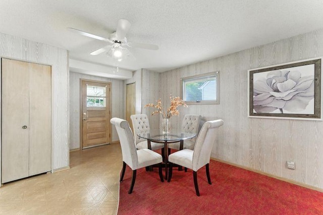 7501 Elliot Ave S, Richfield, MN 55423 - dining area featuring plenty of natural light, ceiling fan, tile patterned floors, and a textured ceiling