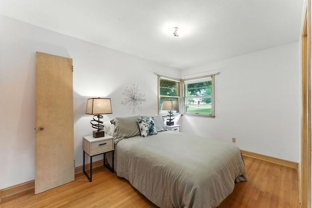 7501 Elliot Ave S, Richfield, MN 55423 - bedroom with light wood-type flooring and baseboards