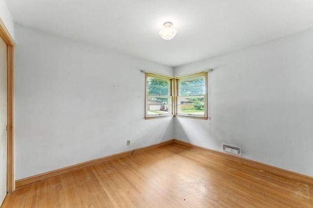 7501 Elliot Ave S, Richfield, MN 55423 - unfurnished room featuring light wood finished floors and baseboards