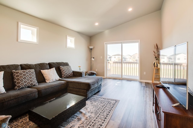 7339 24th St S, Fargo, ND 58104 - living room featuring lofted ceiling, wood finished floors, and recessed lighting