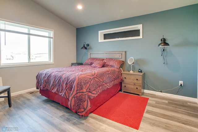 7339 24th St S, Fargo, ND 58104 - bedroom with wood finished floors, vaulted ceiling, and recessed lighting