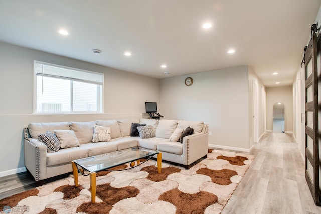 7339 24th St S, Fargo, ND 58104 - living room featuring light wood-type flooring, recessed lighting, and arched walkways