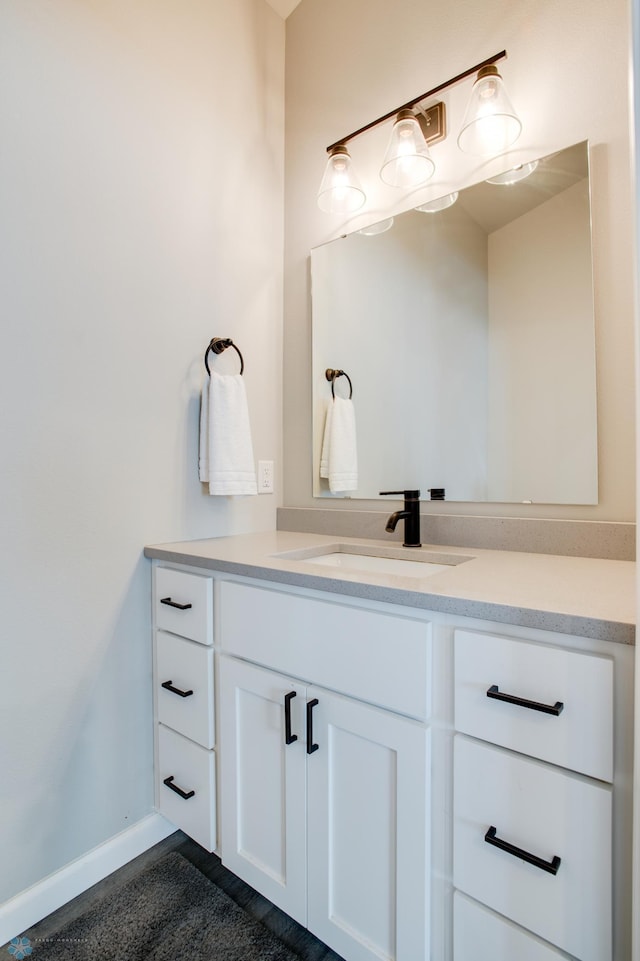 7339 24th St S, Fargo, ND 58104 - bathroom featuring vanity and baseboards